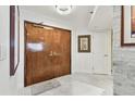 Elegant entryway with double wood doors and a light and airy feel at 1660 Gulf Blvd # Ph1, Clearwater Beach, FL 33767