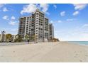 Building's exterior showcasing beach access and beautiful ocean views at 1660 Gulf Blvd # Ph1, Clearwater Beach, FL 33767