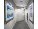 Bright hallway with neutral walls and modern artwork at 175 1St S St # 3102, St Petersburg, FL 33701