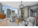 Elegant living room with built-in shelving and panoramic city views at 175 1St S St # 3102, St Petersburg, FL 33701