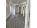 Spacious living area featuring gray vinyl plank flooring at 1916 Seminole S Blvd, St Petersburg, FL 33705