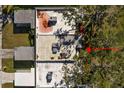 Aerial view of the home's roofline and surrounding trees at 204 Sky Loch W Dr, Dunedin, FL 34698