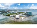 Aerial view of waterfront condos with a pool and parking at 2506 N Rocky Point Dr # 272, Tampa, FL 33607