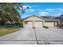 Front view of condo featuring a double garage at 3079 Landmark Blvd # 1606, Palm Harbor, FL 34684