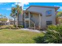 Condo with stairs leading to the entrance at 3079 Landmark Blvd # 1606, Palm Harbor, FL 34684