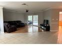 Spacious living room featuring wood and tile floors, access to pool at 3544 Snowy Egret Ct, Palm Harbor, FL 34683