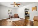 Bright living room with hardwood floors and view into kitchen at 4424 W Bay Villa Ave, Tampa, FL 33611