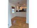 Light and airy dining area with hardwood floors and a view of the kitchen at 4619 W Bay Villa Ave, Tampa, FL 33611