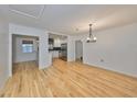 Bright dining room with hardwood floors and chandelier at 4619 W Bay Villa Ave, Tampa, FL 33611