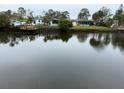 Peaceful waterfront view showcasing neighboring homes and boats at 4919 Shore Acres Ne Blvd, St Petersburg, FL 33703