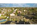 Aerial view of community with pool and lake at 8615 Carroll Oaks Dr, Tampa, FL 33614