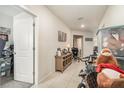 Bright hallway with tiled floors, offering access to other rooms at 9215 Royal River Cir, Parrish, FL 34219