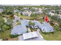 Aerial view showing condo location near canal and other homes at 1018 Caravel Ct, Tarpon Springs, FL 34689