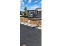 Front view of manufactured home with walkway and landscaping at 103 E Saint Lucia Loop, Apollo Beach, FL 33572