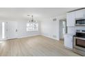 Bright dining area with wood-look floors and white walls at 10821 Freedom Blvd, Seminole, FL 33772