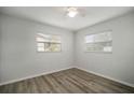 Bright bedroom with wood-look floors and ceiling fan at 1203 Baronwood Pl, Brandon, FL 33510