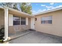 Front porch with two white metal chairs at 1203 Baronwood Pl, Brandon, FL 33510