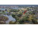 Bird's eye view of a mobile home near a lake and residential area at 12914 Gordon Rd, Riverview, FL 33579