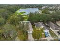 Aerial view showing house location near a lake and other homes at 1415 Mohrlake Dr, Brandon, FL 33511