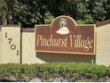 Pinehurst Village community entrance sign at 1701 Pinehurst Rd # 8B, Dunedin, FL 34698