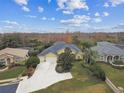 Bird's-eye view of a house with a large backyard and surrounding neighborhood at 2126 Larchwood Ct, Trinity, FL 34655