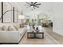 Spacious living room with light-colored sofa and coffee table at 2126 Larchwood Ct, Trinity, FL 34655