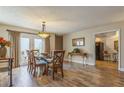 Elegant dining room with hardwood floors and a glass-top dining table at 2241 Heron Circle, Clearwater, FL 33762