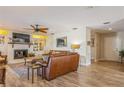 Living room with hardwood floors, fireplace and built-in shelving at 2241 Heron Circle, Clearwater, FL 33762