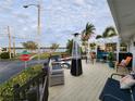 Relaxing waterfront deck with patio furniture at 236 Carol Dr # 236, Seminole, FL 33772