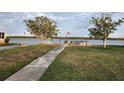 Private walkway to waterfront with picnic tables at 236 Carol Dr # 236, Seminole, FL 33772