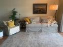 Living room with comfy sofa and decorative accents at 25225 Rampart Blvd # 1902, Punta Gorda, FL 33983