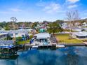 Aerial view of a waterfront home with a dock and boat at 5421 Circle Dr, Weeki Wachee, FL 34607