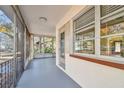 Screened porch with access to backyard and exterior door at 5620 Montana Ave, New Port Richey, FL 34652