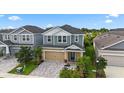 Two-story house in a community with similar homes at 5636 Silver Sun Dr, Apollo Beach, FL 33572