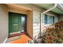 Inviting front entryway featuring a classic painted door, tiled flooring, and neatly landscaped surroundings at 6909 13Th N Ave, St Petersburg, FL 33710