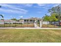 House with black fence and gate, view from across the street at 2715 9Th N Ave, St Petersburg, FL 33713