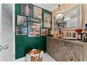 Stylish home bar with green walls and unique artwork at 1208 E Kennedy Blvd # 410, Tampa, FL 33602
