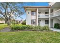 Condo building exterior showcasing entrance and landscaping at 130 Lakeview Way # 130, Oldsmar, FL 34677