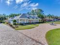 Spacious home with a long driveway and a circular courtyard at 1503 Limona Rd, Brandon, FL 33510
