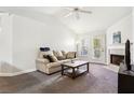 Living room featuring a fireplace, TV, and comfortable seating at 18119 Sterling Gate Cir # 18119, Tampa, FL 33647