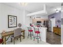 Eat-in kitchen with stainless steel appliances and breakfast bar at 20922 Jaffa Ln, Land O Lakes, FL 34637