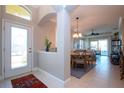 Bright and spacious entryway leading to dining and living areas at 2501 Sapphire Greens Ln, Sun City Center, FL 33573