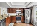 Modern kitchen with stainless steel appliances and granite countertops at 3303 Brigadoon Dr, Clearwater, FL 33759