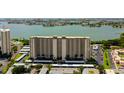 Aerial view of a high-rise building near the water at 7050 Sunset S Dr # 208, South Pasadena, FL 33707