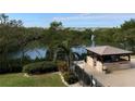 Relaxing pool and spa area with gazebo and water views at 7050 Sunset S Dr # 208, South Pasadena, FL 33707