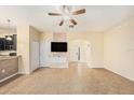 Spacious living room with tile floors and access to a back patio at 8110 Hampton View Ln, Tampa, FL 33647