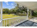 View from the front porch showcasing a tree-lined street at 9415 Forest Hills Dr, Tampa, FL 33612