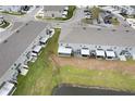 Aerial view showing townhouses and a pond at 9642 Sweetwell Pl, Riverview, FL 33569