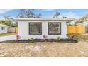 Front view of a remodeled home with new landscaping at 11882 104Th St, Largo, FL 33773