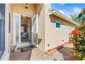 Inviting front entry with glass doors and brick walkway at 15767 Crystal Waters Dr, Wimauma, FL 33598